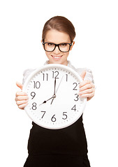 Image showing woman holding big clock