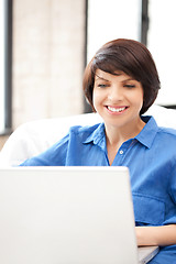 Image showing happy woman with laptop computer