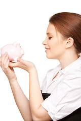 Image showing lovely woman with piggy bank