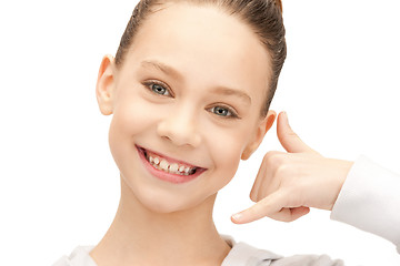 Image showing teenage girl making a call me gesture