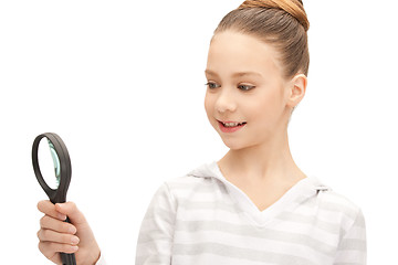 Image showing teenage girl with magnifying glass