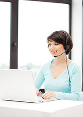 Image showing helpline operator with laptop computer