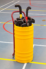 Image showing Hockeysticks in an old school gym