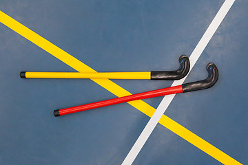 Image showing Hockeysticks in an old school gym