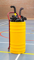 Image showing Hockeysticks in an old school gym