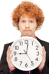 Image showing man with clock