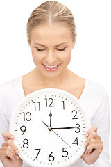 Image showing woman holding big clock