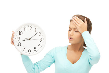 Image showing woman holding big clock