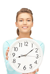 Image showing woman holding big clock