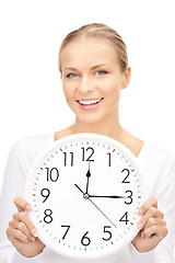 Image showing woman holding big clock