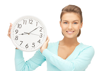 Image showing woman holding big clock