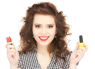 Image showing beautiful woman polishing her nails