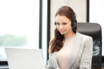 Image showing helpline operator with laptop computer