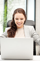 Image showing happy woman with laptop computer