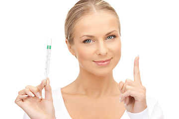 Image showing attractive female doctor with thermometer