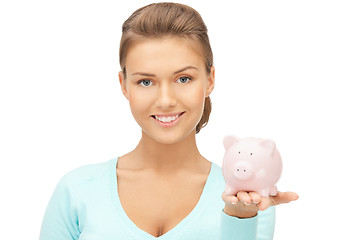 Image showing lovely woman with piggy bank