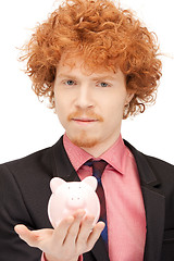 Image showing man with piggy bank