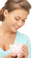 Image showing lovely woman with piggy bank