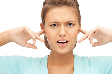 Image showing woman with fingers in ears