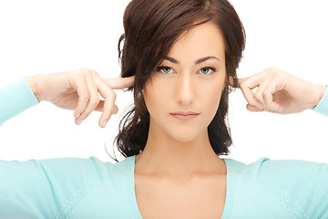 Image showing woman with fingers in ears