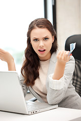 Image showing unhappy woman with computer and euro cash money