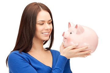 Image showing lovely woman with piggy bank