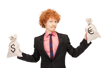 Image showing man with euro and dollar bags