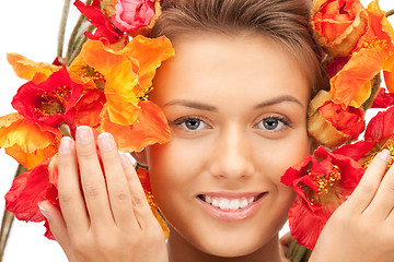 Image showing lovely woman with red flowers