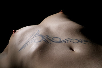 Image showing female breast and tattoo