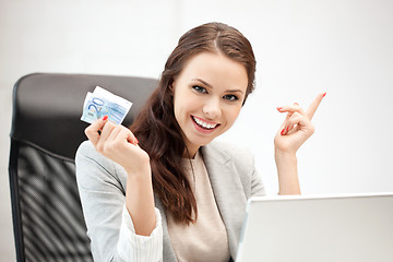 Image showing woman with laptop computer and euro cash money