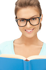 Image showing happy and smiling woman with book