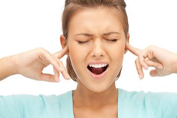 Image showing woman with fingers in ears