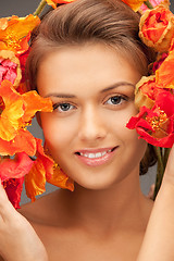 Image showing lovely woman with red flowers
