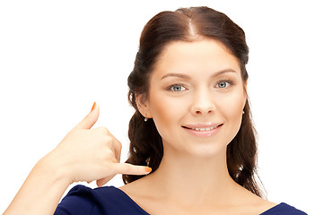 Image showing woman making a call me gesture