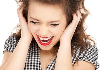 Image showing woman with hands on ears