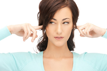 Image showing woman with fingers in ears