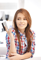 Image showing pensive woman with credit card