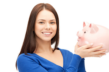 Image showing lovely woman with piggy bank