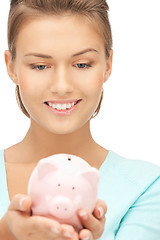 Image showing lovely woman with piggy bank