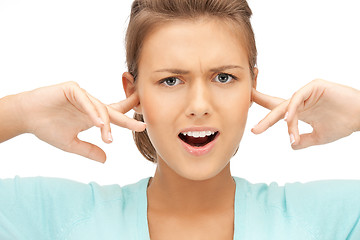 Image showing woman with fingers in ears