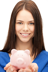 Image showing lovely woman with piggy bank