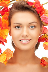 Image showing lovely woman with red flowers