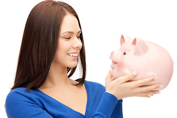 Image showing lovely woman with piggy bank