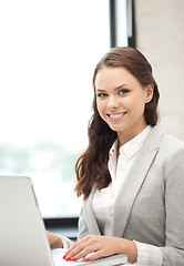 Image showing happy woman with laptop computer