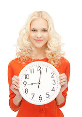 Image showing woman holding big clock