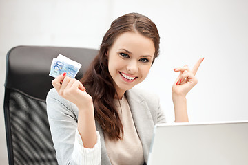 Image showing happy woman with computer and euro cash money