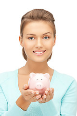 Image showing lovely woman with piggy bank