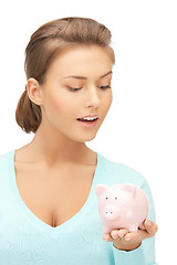 Image showing lovely woman with piggy bank