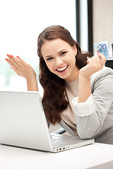 Image showing happy woman with computer and euro cash money