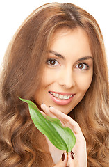 Image showing woman with green leaf